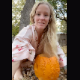 A pretty blonde girl takes a long, smooth sit into a carved pumpkin. Poop action is shown from 2 different angles. Product reveal at the end of the clip. About 2 minutes.